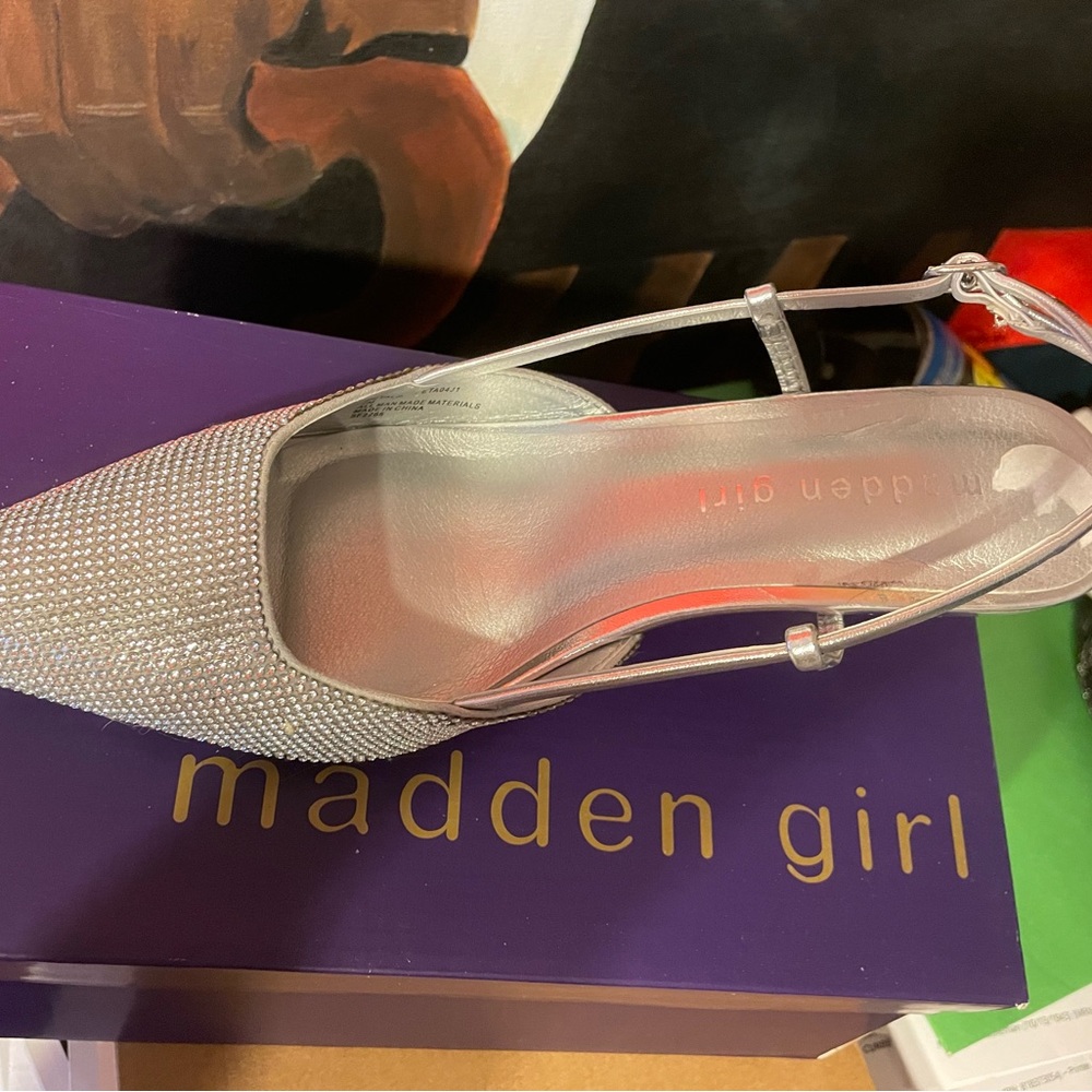 Rinstone heels, never worn. But tried on.